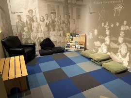 Corner of the Hands-On History exhibit on the first floor with a variety of seating options