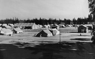 Photo by Robert Hemmig of a migrant camp. 