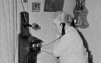 An Iowa resident calls a switchboard operator to connect her call in 1940. 