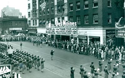 Photo from outside the Des Moines Theater of the Women's Army Corps company from the Fort Des Moines training center at opening event for the premiere of the motion picture film "Women at War."