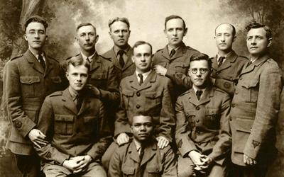 A military picture of 10 soldiers (1 African American) who are YMCA Educational Secretaries from Camp Dodge in 1918.