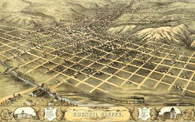 The lithograph of Council Bluffs is centered on Broad Street as it ran from the northeast to the Missouri River. The streets are organized in a grid pattern, with the commercial buildings centered on Broad and Main Streets and residential buildings spread across the city. The densest areas are in the area of Broad and Main Streets.