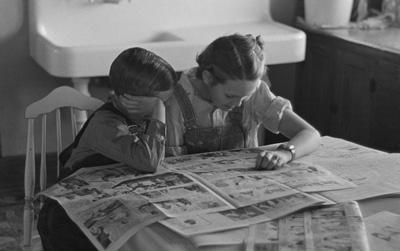 Children Reading the Sunday Newspaper in Dickens, Iowa, December 1936