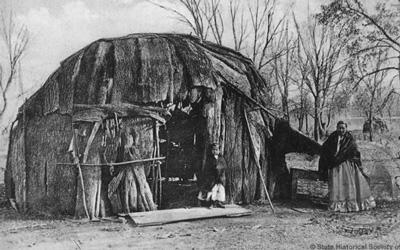 Meskwaki Woman and Child by a Wickiup in Tama, Iowa, Date Unknown 