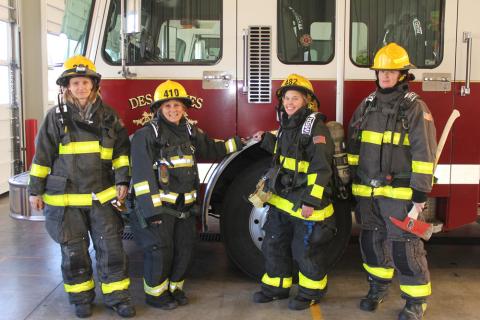 Four Des Moines Firefighters Stand by a Fire Engine, 2019