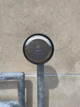 Link to a high resolution image of the button to activate the automatic doors at the Centennial Building entrance