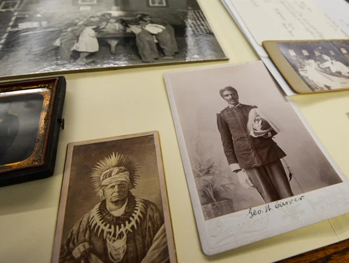 Multiple old photos, one of a Native American and another of another man.