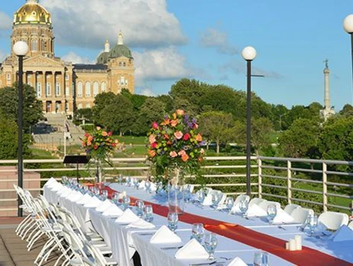 Banquet set up on the Cafe Terrace of the State Historical Building with views of the Iowa State Capitol.