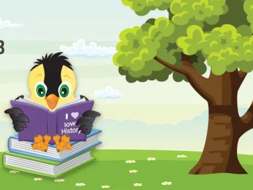 Goldie reading a book titled, I heart Iowa History