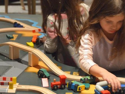 Young children play in the Hands-On History exhibit