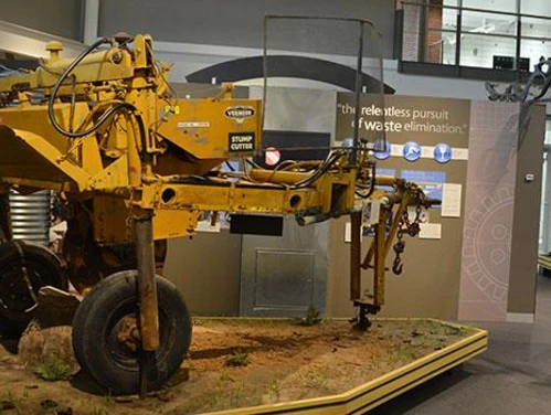 Farming equipment on exhibit in a museum.