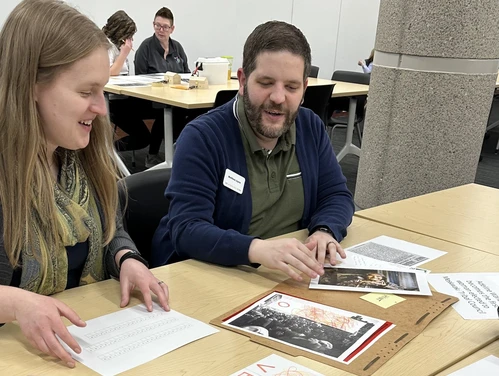 Two adults work on escape room