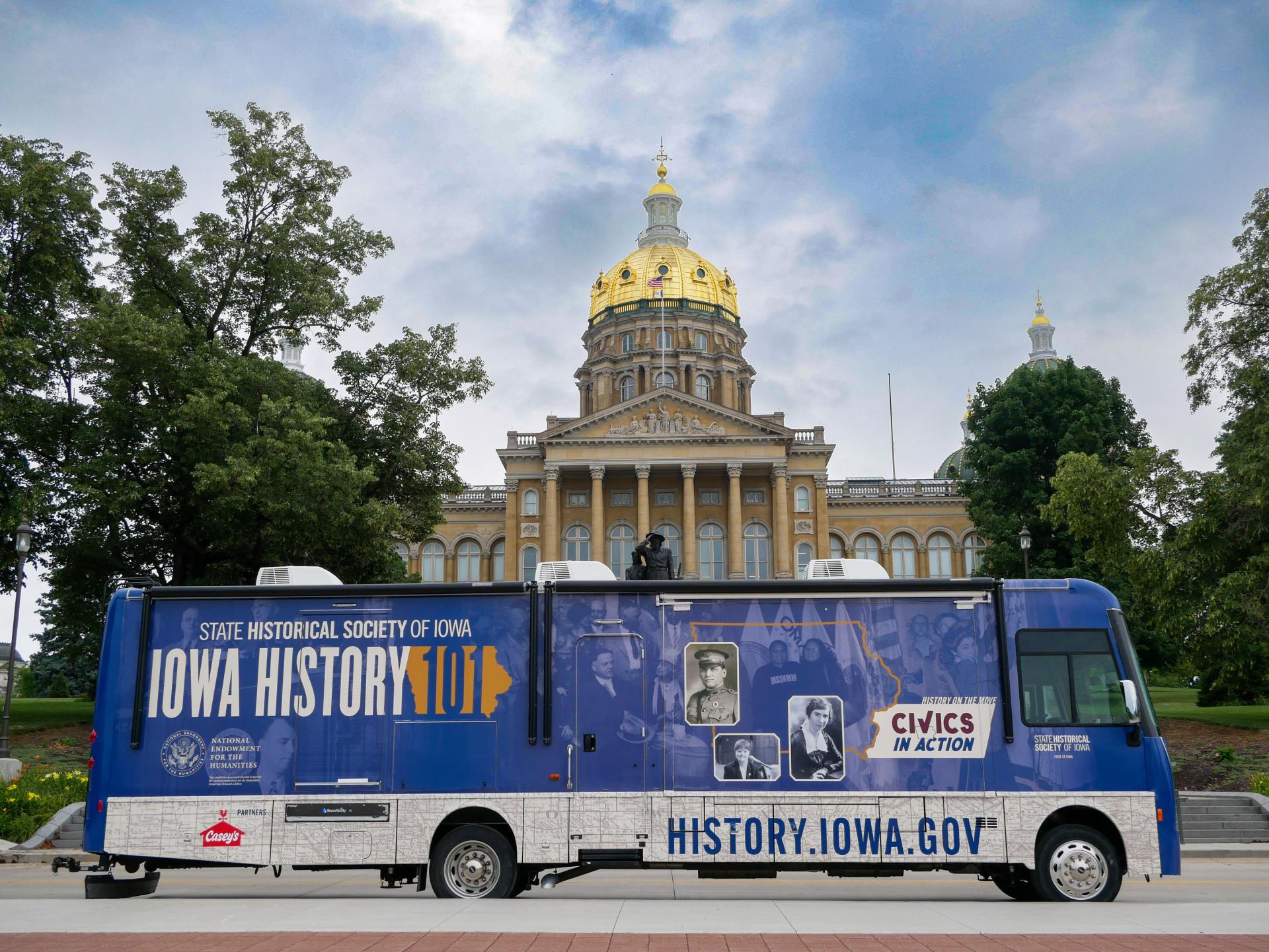 The Mobile Museum 3.0 is parked in front of a view of the Capitol Building in Des Moines