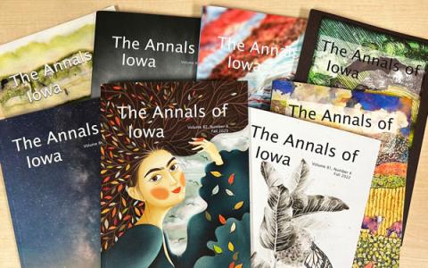 Eight covers of the Annals of Iowa each featuring artwork by Iowa artists
