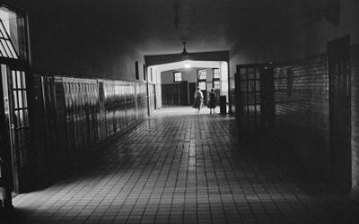 Photograph shows an almost-empty hallway at Central High School in Little Rock, Arkansas in 1958.