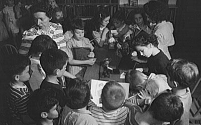 Third-Grade Students Checking Out Books at School Library in New York, June 1943