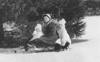 Ellen and Barbara Douglas on a Sled with their Nanny "Danny," Date Unknown