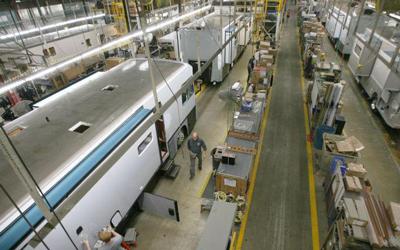 Workers assemble recreational vehicles at Winnebago Industries in Forest City in a file photo from 2013. Company officials announced on Friday an additional plant will be opened in Waverly.