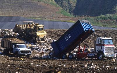 Truck Dumping Trash at a Landfill, Date Unknown