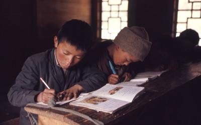 Young boys reading and writing in school, Lachung, Sikkim.