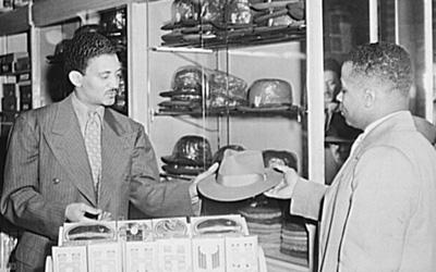 Salesman Selling a Hat to a Customer in Chicago, Illinois, April 1952