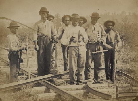 This photograph of a group of eight African-Americans constructing a railroad in northern Virginia for the United States Military Railway Department was taken by Andrew J. Russell in either 1862 or 1863. Most of the men can be seen holding tools required for laying railroad track.