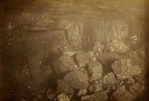Photograph inside Buxton #12 mine shows pieces of rock and coal that miners were working on moving circa 1910.