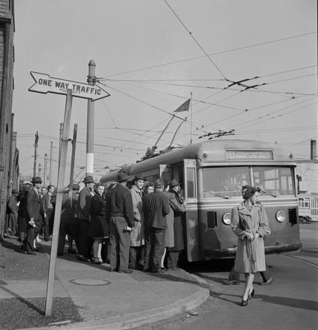 Workers board a trolley car in Baltimore, Maryland.