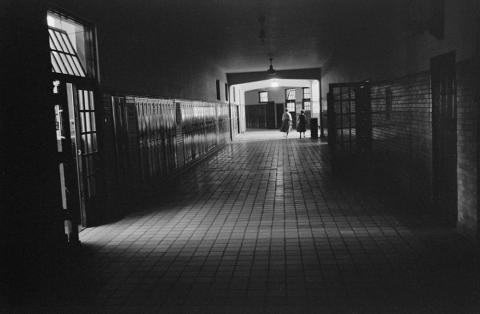 Photograph shows an almost-empty hallway at Central High School in Little Rock, Arkansas in 1958.