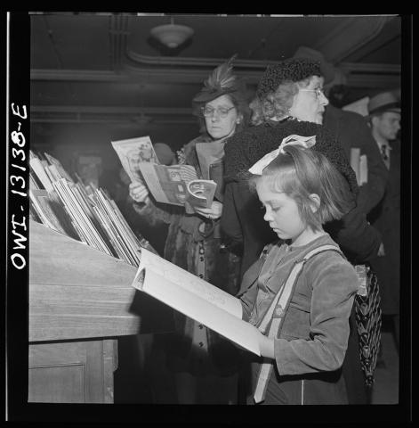 Little Girl Looking at Book in R.H. Macy and Company Department Store in New York, December 1942 
