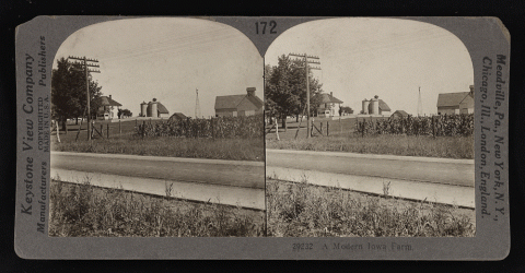 Stereograph showing a view of a farm, house, barn and other buildings on the property.