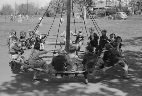 Students swinging on a playground in Texas in 1939.