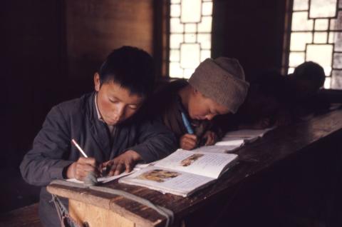 Young boys reading and writing in school, Lachung, Sikkim.