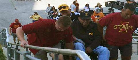  Iowa State football fans help elderly Iowa fan into Jack Trice Stadium