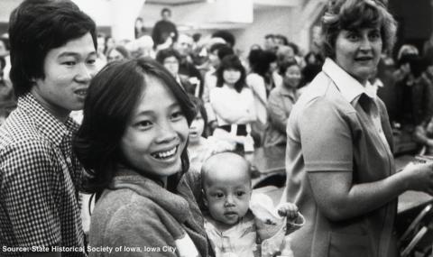 An unidentified Vietnamese woman and child in the crowd of Vietnamese refugees in Iowa.