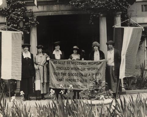 This photograph, taken at the June 1920 Republican National Convention in Chicago, depicts six suffragists (including Alice Paul, second from the right) gathered in front of a building with suffrage banners, one of them quoting the influential suffragette Susan B. Anthony.