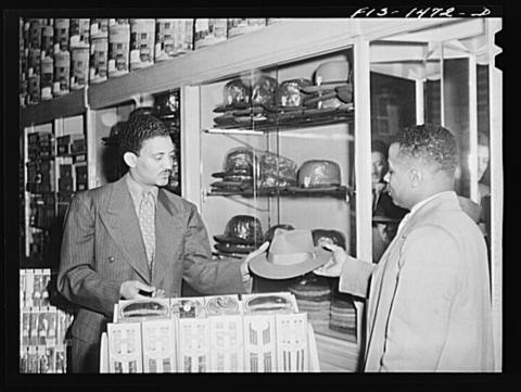 Salesman Selling a Hat to a Customer in Chicago, Illinois, April 1952