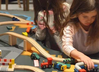 Young children play in the Hands-On History exhibit