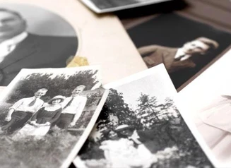 Pile of black and white portrait photographs.