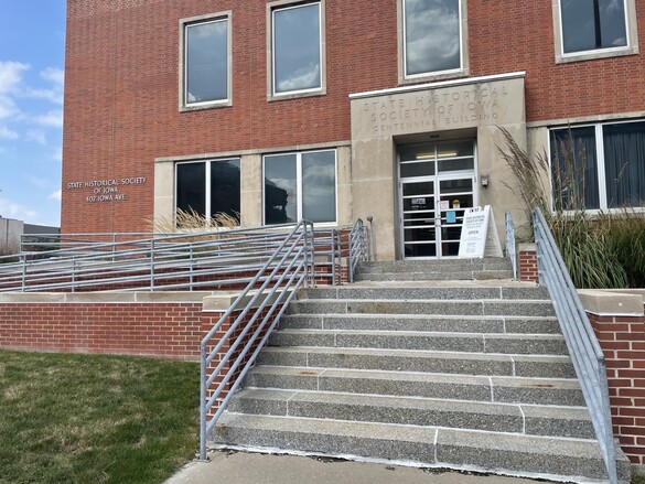 Exterior view of the Centennial Building entrance on Iowa Avenue with stairs