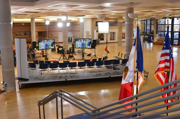 State Historical Building atrium set up for a presentation with video screens