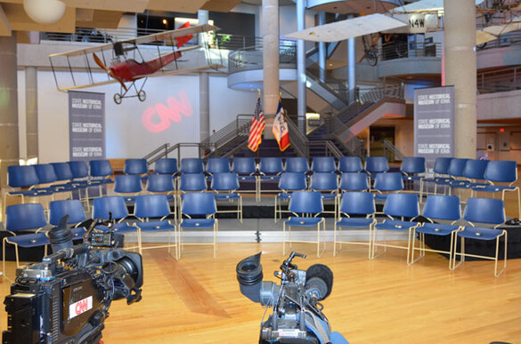State Historical Building atrium set up for a CNN video presentation with television screens and cameras