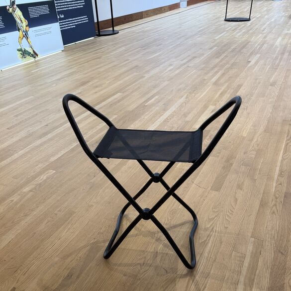 Portable black museum stool