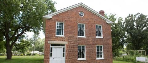 Two-story brick Plum Grove Historic Home