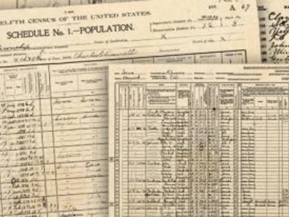 View of Census records laid out on a table.