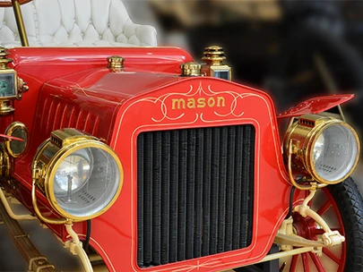 Automobile, 1906 Mason Runabout. Made by the Mason Motor Car Company in Des Moines, Polk County, at a building at 100 S. E. 5th St. August and Frederick Duesenberg of Rockford, Cerro Gordo County, worked for this firm. Assembled from at least two vehicles and fully restored. Donated by E.T. Meredith, III, 1933-2003, of Des Moines, Iowa on September 24, 1998He was the grandson of E. T. Meredith, the founding publisher of Meredith Corporation. 