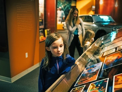 A young girl in the Hollywood in the Heartland exhibit at the museum